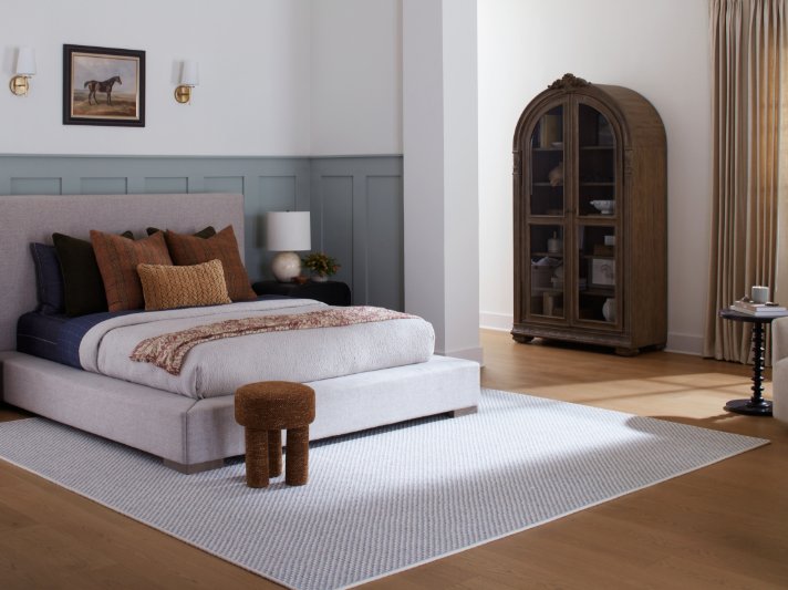 Karastan Belleluxe Flooring with a grey area rug in a stylish bedroom